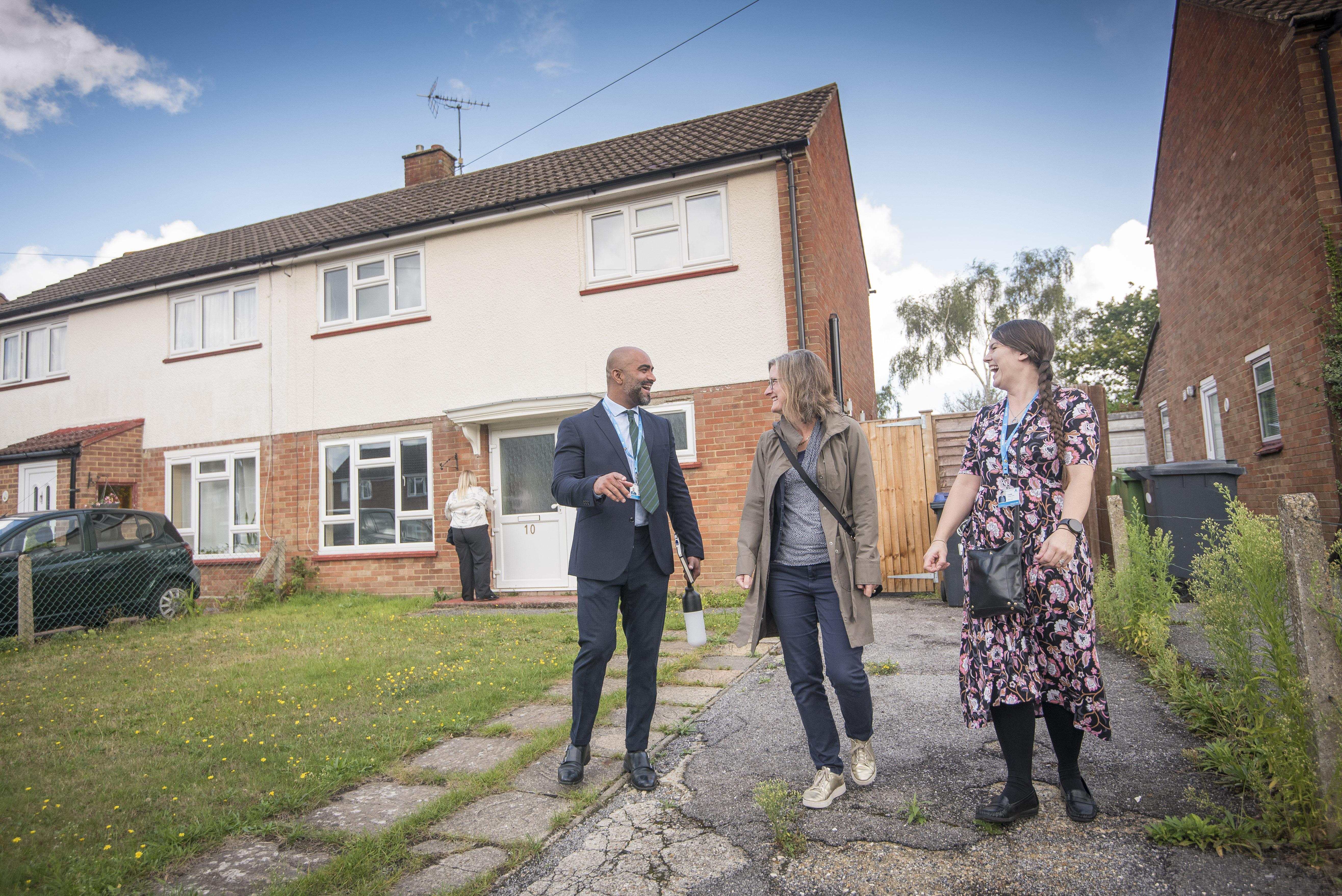 Three Colleagues Outside House