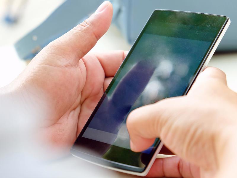 A close-up of someone holding a smartphone