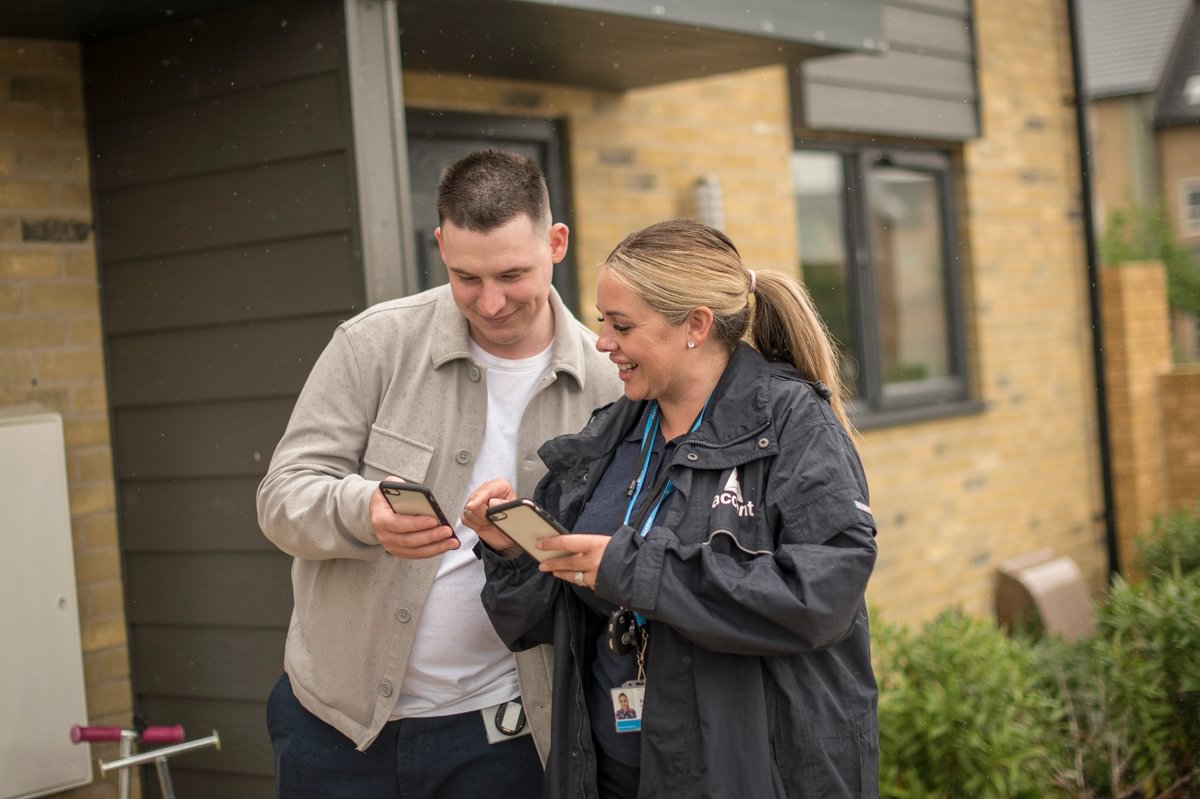 Two Housing Partners Working Outside