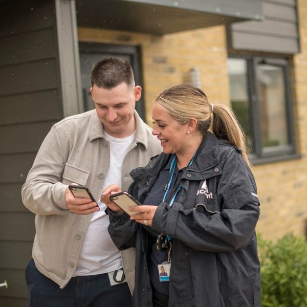 Two Housing Partners Working Outside