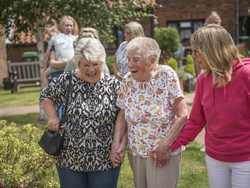 Group Of Older Women In Garden Laughing