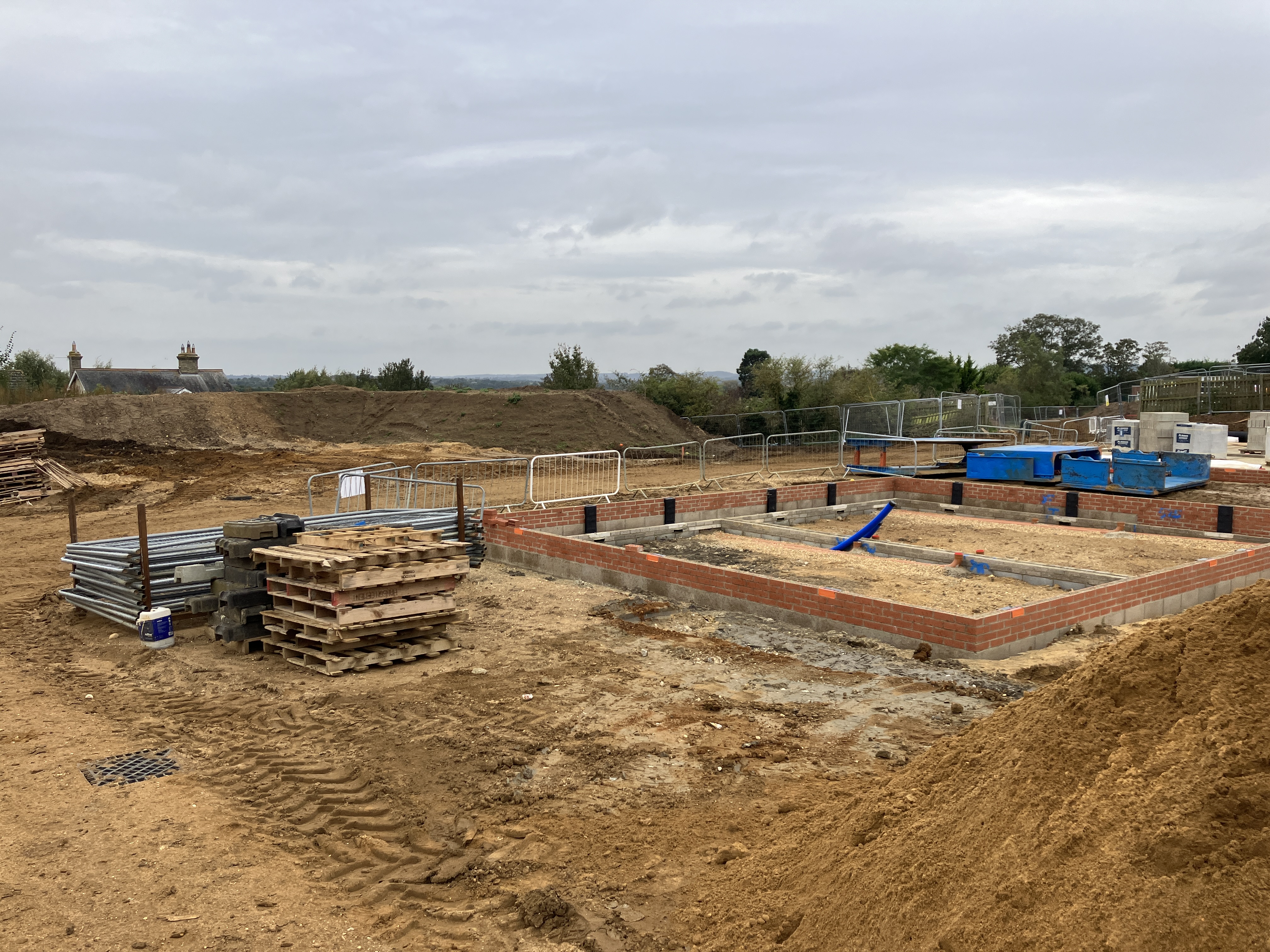 A building site with brick foundations of a building visible