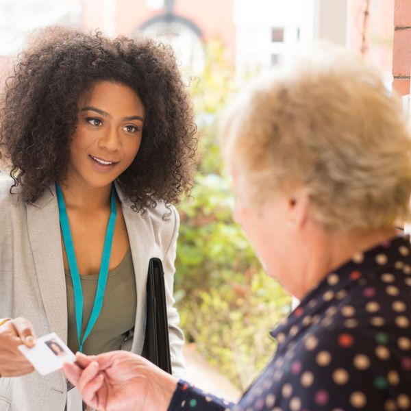 Customer Greeting Worker At The Door