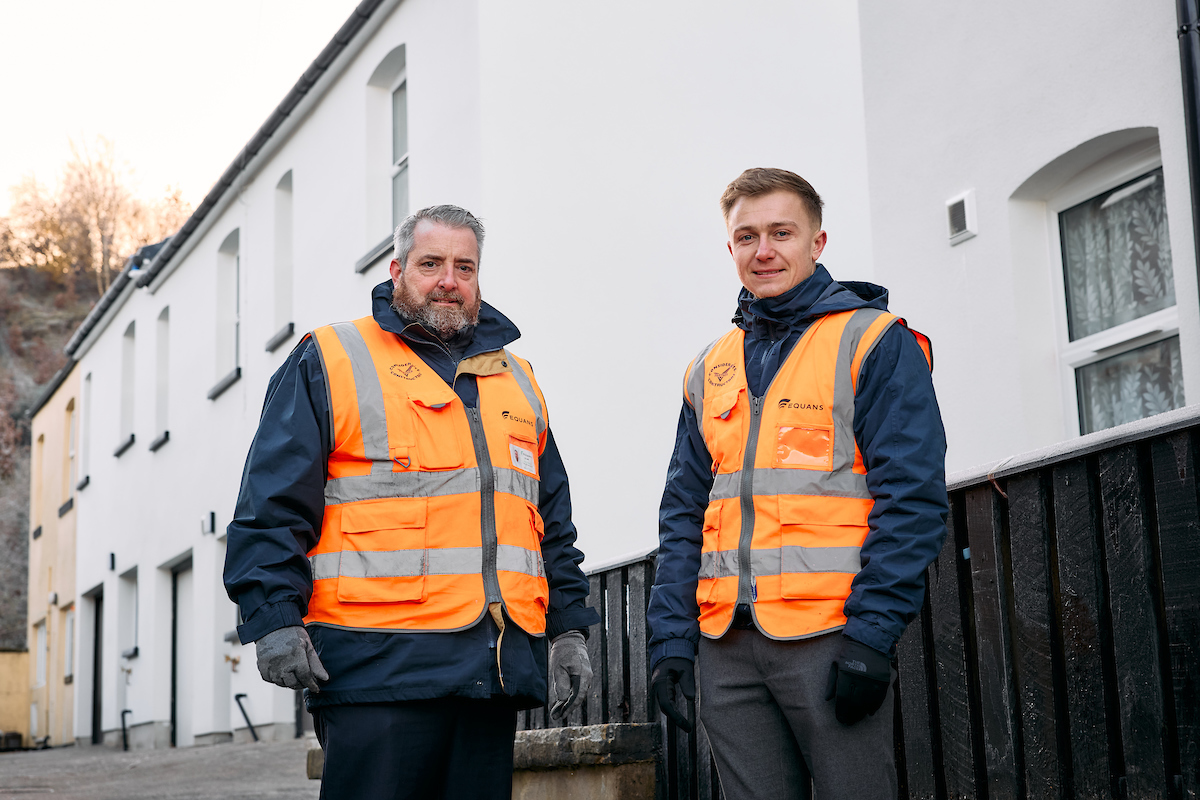 Two Men In High Vis Posing On Finished Development