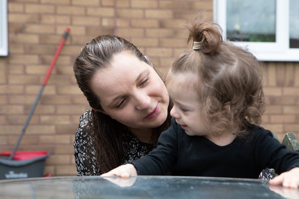 Mother And Child Sat Outside