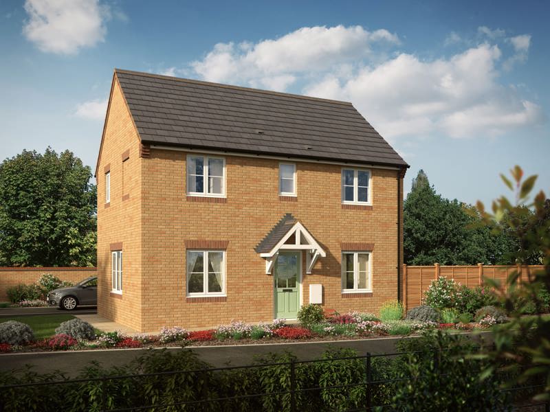 A large, two-storey home with lots of windows and a light green door way surrounded by blooming flower-beds