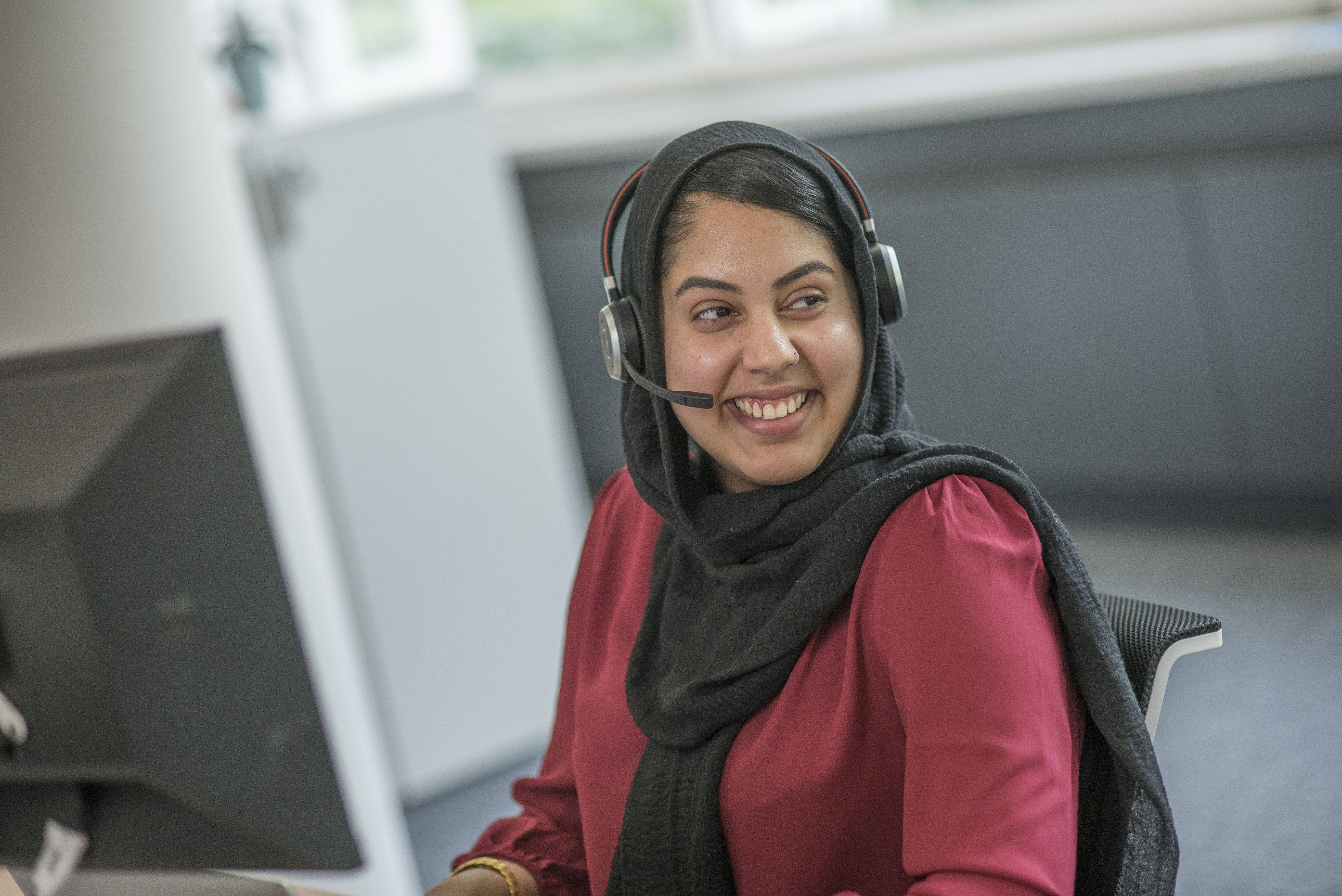 Smiling Lady In Accent Call Centre